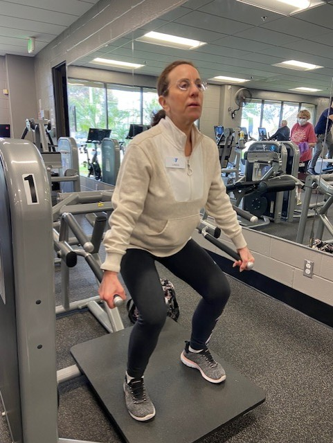 Linda training with a step platform, sculpting lean defined legs