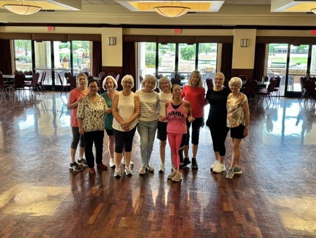 Group of women after a Zumba class in a community ballroom